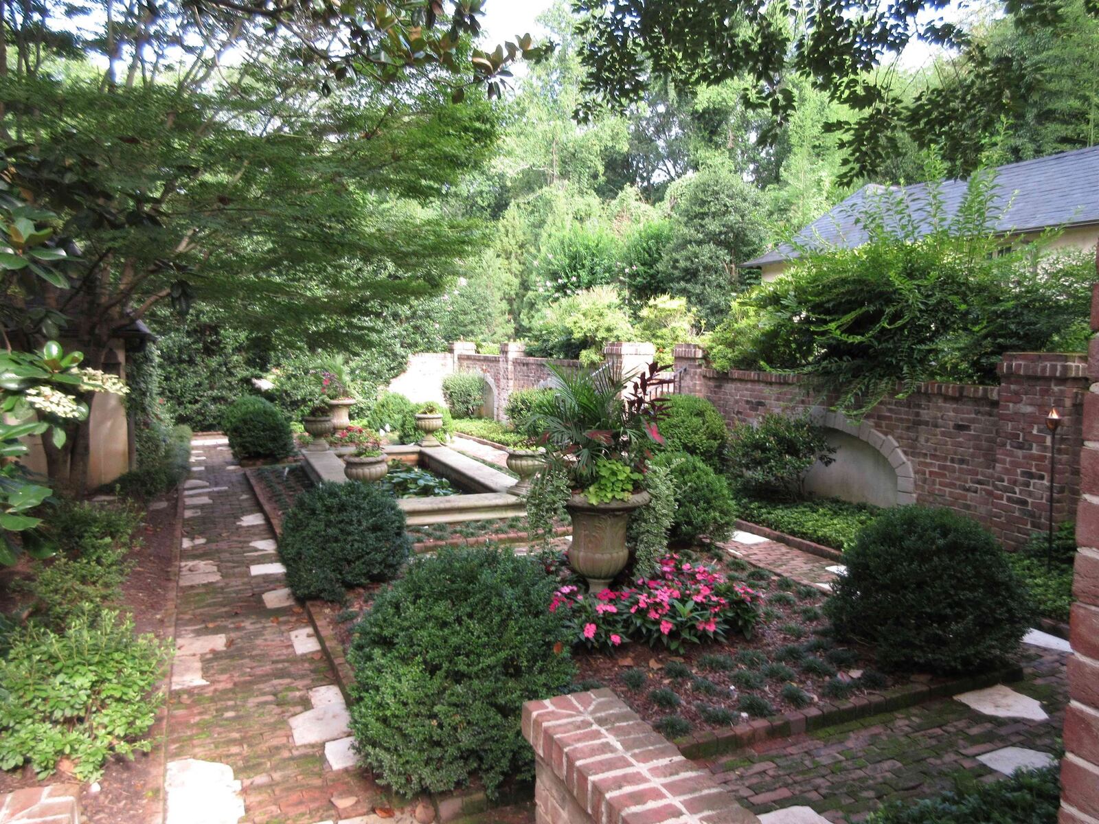 Kristy and Michael Robison’s formal English-style garden will be featured on the tour. Contributed.