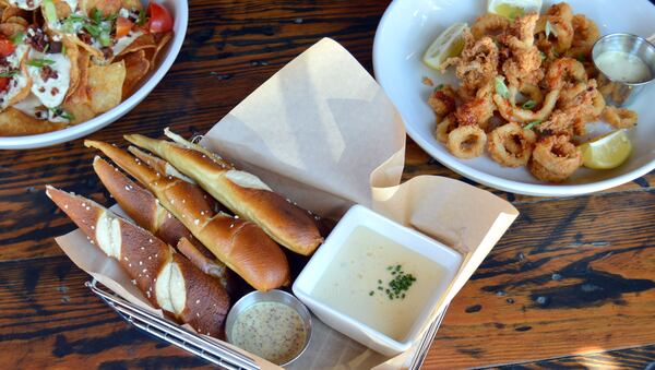 McCray's Tavern on the Square offers pub fare, with appetizers like, from left, Gorgonzola chips, "Belgium Ale" pretzels and crispy calamari. Photo credit: McCray's Tavern on the Square.