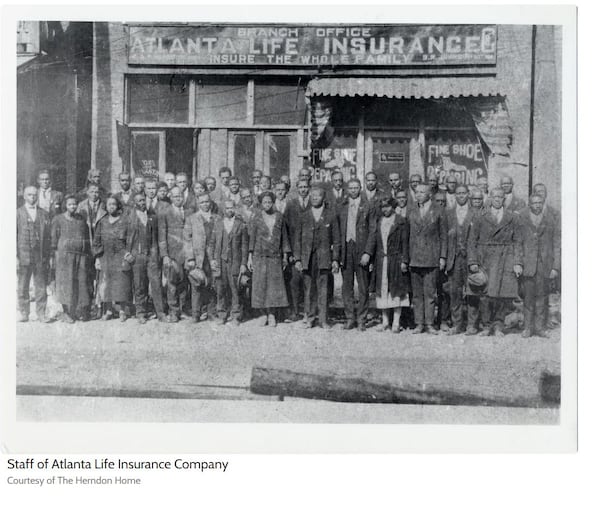 In this undated photograph, the staff of the Atlanta Life Insurance Co. poses in front of the building located at 229 Auburn Ave. (Courtesy of the Herndon Home)