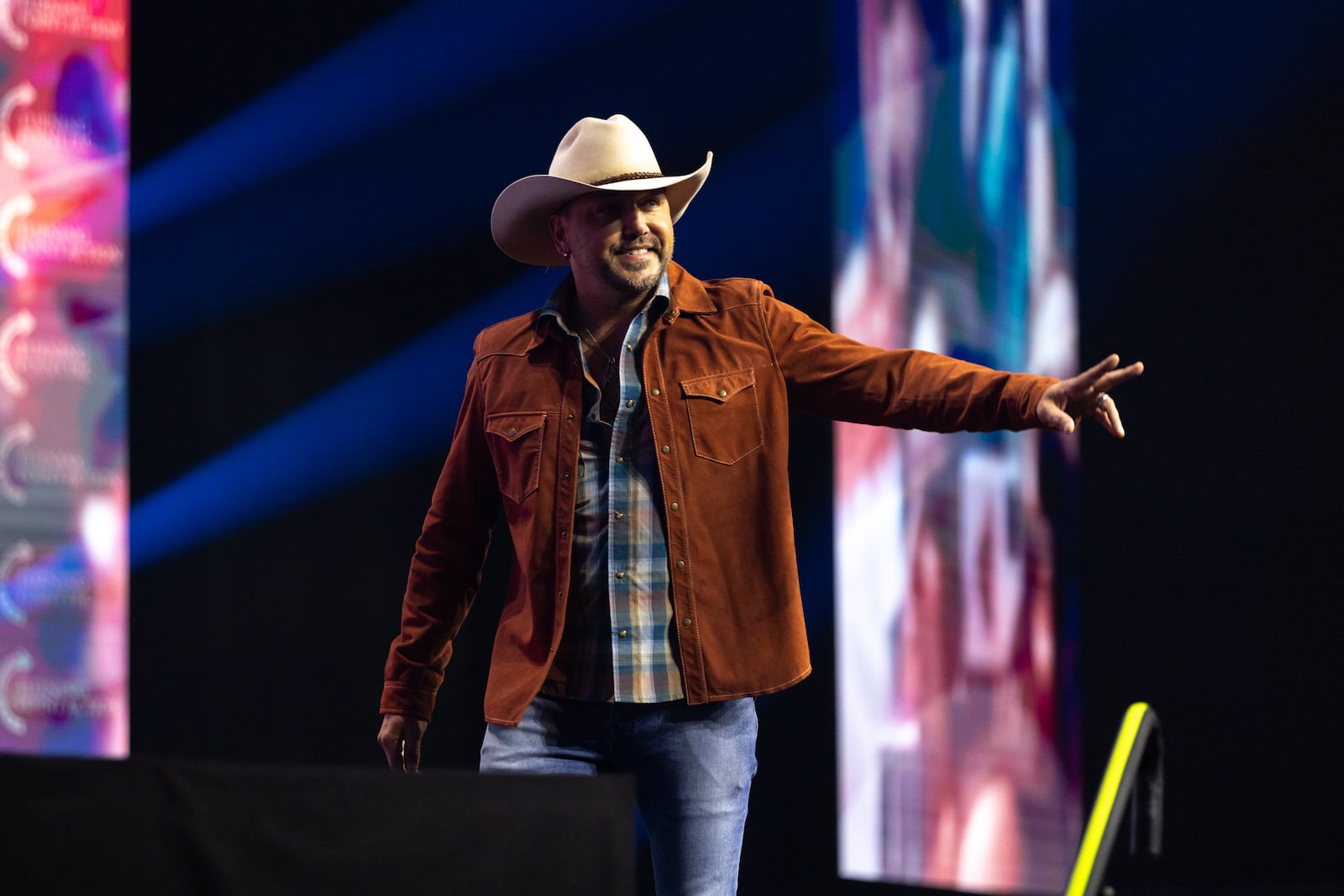 Country singer Jason Aldean leaves the stage after speaking during a campaign rally for former President Donald Trump in Duluth on Wednesday.