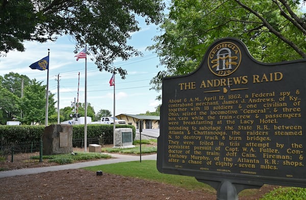 The Kennesaw City Council voted June 15 to remove the Confederate battle flag and replace it with the original Georgia state flag (left) that was flown during the Civil War at the city’s war memorial in downtown Kennesaw. HYOSUB SHIN / HYOSUB.SHIN@AJC.COM