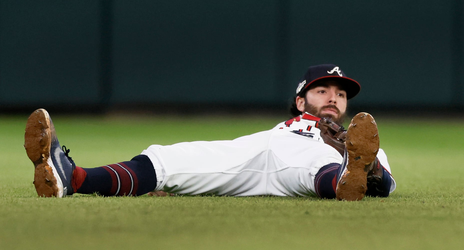 Atlanta Braves shortstop Dansby Swanson (7) makes an over the shoulder catch of the popup by Philadelphia Phillies’ J.T. Realmuto during the sixth inning of game two of the National League Division Series at Truist Park in Atlanta on Wednesday, October 12, 2022. (Jason Getz / Jason.Getz@ajc.com)