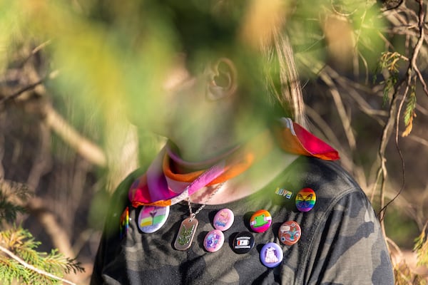 Dare, 16, of Dacula is nonbinary and doesn’t identify as strictly male or female. Dare, who uses "they" as their pronoun, has never been able to secure an appointment to get a diagnosis of gender dysphoria and begin medical treatment, so their transition has been social — meaning changing their names and dressing in a way that more aligns with their gender identity.  (Arvin Temkar / arvin.temkar@ajc.com)