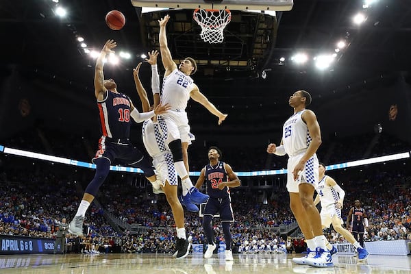 Auburn's Samir Doughty takes a shot against Kentucky's Keldon Johnson (3) and Reid Travis (22) during the 2019 NCAA Basketball Tournament Midwest Regional March 31, 2019, at Sprint Center in Kansas City, Mo.