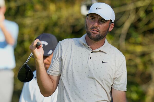 Scottie Scheffler watches his tee shot on the 15th hole during the first round of The Players Championship golf tournament Thursday, March 13, 2025, in Ponte Vedra Beach, Fla. (AP Photo/Chris O'Meara)