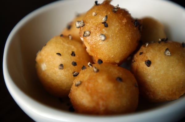 Fried goat cheese with honey and black pepper at Ecco. / AJC file photo