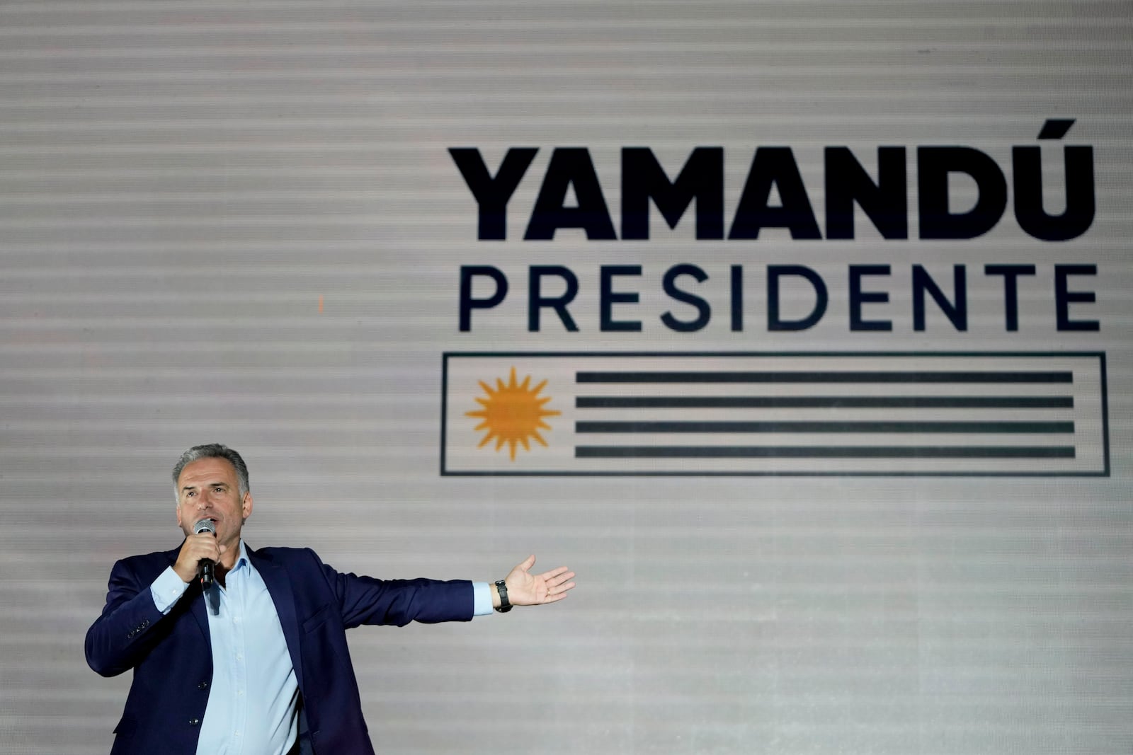 Frente Amplio presidential candidate Yamandu Orsi talks to supporters outside of a hotel after general elections polls closed in Montevideo, Uruguay, Sunday, Oct. 27, 2024. (AP Photo/Natacha Pisarenko)