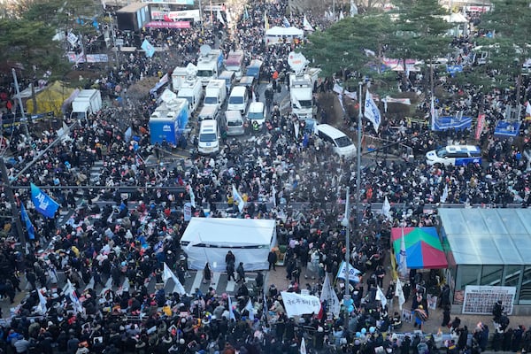 Participants gather during a rally to demand South Korean President Yoon Suk Yeol's impeachment outside the National Assembly in Seoul, South Korea, Saturday, Dec. 14, 2024. (AP Photo/Ahn Young-joon)