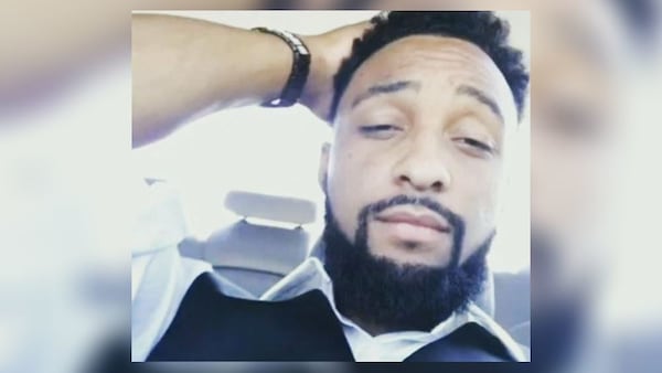 John Battle, 28, was in a car with his girlfriend and daughter when he was fatally struck by a stray bullet Thursday night outside a Shell gas station in DeKalb County.