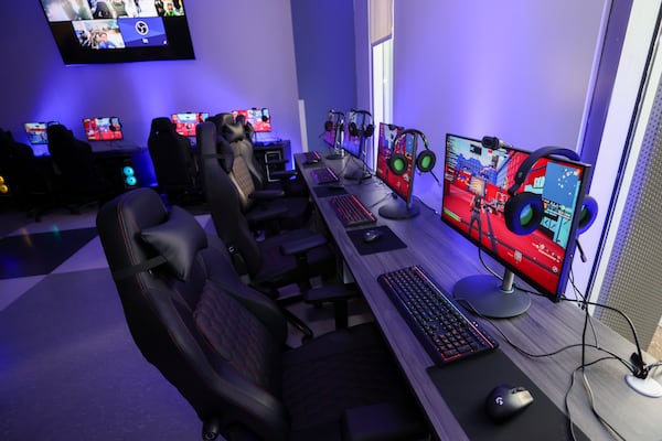 The MLK E Sports Lab has 20 gaming PCs, which are decked out with gaming chairs, keyboards, headsets and mice. (Jason Getz/AJC)