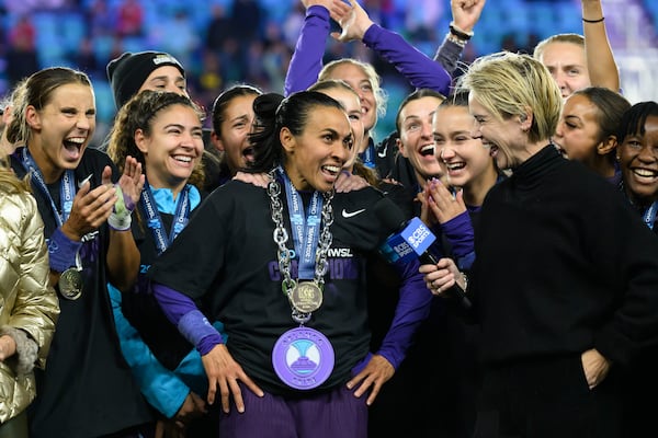 Orlando Pride forward Marta, center, is interviewed after their NWSL championship win over the Washington Spirit at CPKC Stadium, Saturday, Nov. 23, 2024, in Kansas City, Mo. (AP Photo/Reed Hoffmann, File)