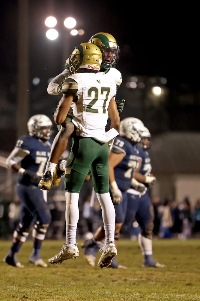 Dec. 18, 2020 - Norcross, Ga: Grayson defensive back AJ Lopez (27) celebrates his interception with teammate Mumu Bin-Wahad (6) in the first half against Norcross in the Class AAAAAAA semi-final game at Norcross high school Friday, December 18, 2020 in Norcross, Ga.. Grayson won 28-0 to advance to the Class AAAAAAA finals. JASON GETZ FOR THE ATLANTA JOURNAL-CONSTITUTION