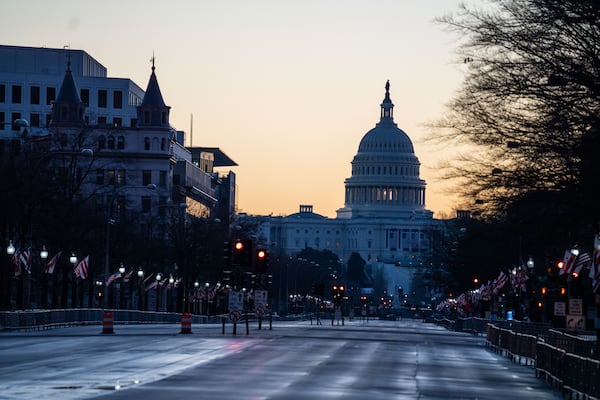 The sun rises behind the U.S. Capitol Building, seen from Pennsylvania Avenue in Washington, D.C. (Kent Nishimura/Los Angeles Times/TNS)