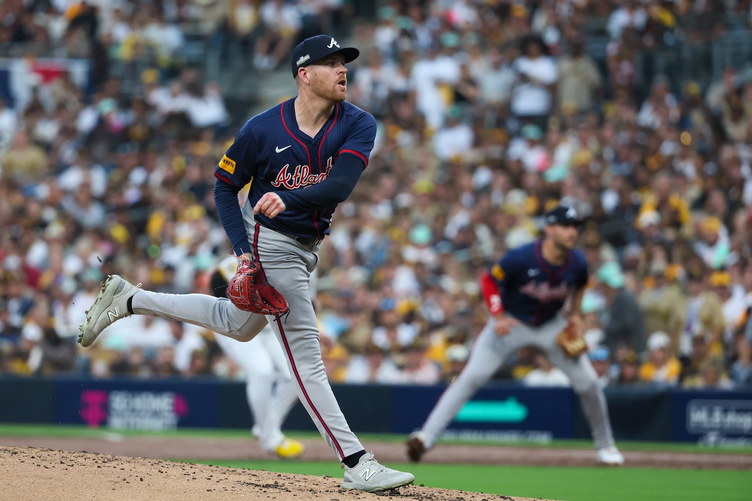 Atlanta Braves pitcher Aaron Bummer (49) delivers to the San Diego Padres after a pitching change in the second inning of National League Division Series Wild Card Game One at Petco Park in San Diego on Tuesday, Oct. 1, 2024.   (Jason Getz / Jason.Getz@ajc.com)