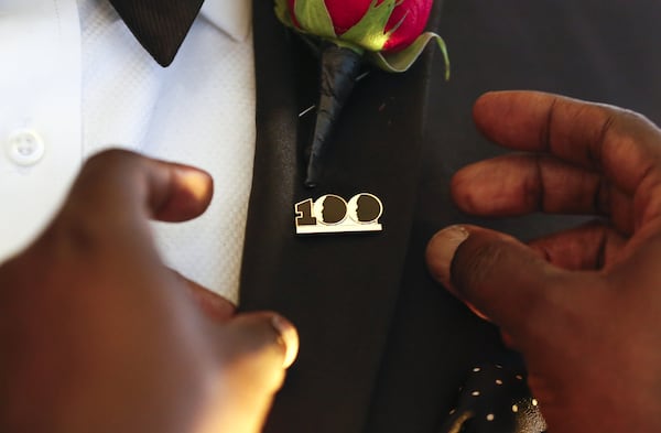 A new member is pinned by an existing member during the induction ceremony Dec. 2 at the 100 Black Men of Atlanta 2018 Gala held at Bentley Atlanta in Alpharetta. (Casey Sykes for The Atlanta Journal-Constitution)