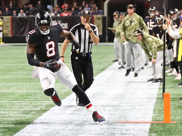 Falcons tight end Kyle Pitts is forced out of bounds on a first down reception against the Patriots during the first half in a NFL football game on Thursday, Nov. 18, 2021, in Atlanta.    “Curtis Compton / Curtis.Compton@ajc.com”