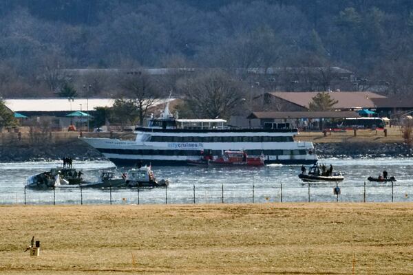 Search and rescue efforts are seen around a wreckage site in the Potomac River from Ronald Reagan Washington National Airport, early Thursday morning, Jan. 30, 2025, in Arlington, Va. (AP Photo/Stephanie Scarbrough)