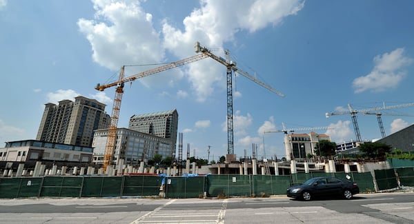 In June 2010, cranes stand guard over the main construction site of Streets of Buckhead project. AJC 2010