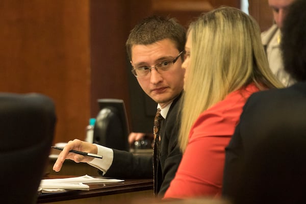 7/11/2019 -- McDonough, Georgia -- Joseph Rosenbaum (center) speaks with his wife Jennifer (right) during their trial in front of Henry County Chief Judge Brian Amero at the Henry County Superior courthouse, Thursday, July 11, 2019. (Alyssa Pointer/alyssa.pointer@ajc.com)