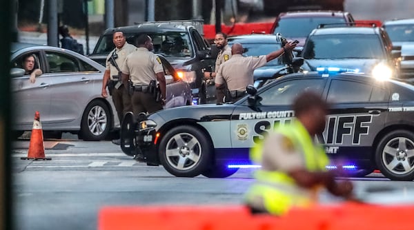 Fulton County Sheriff deputies shut off Central Avenue (shown here) and other surrounding streets at the Fulton County Courthouse on Monday, May 2, 2022 as the selection of a special grand jury began. (John Spink / John.Spink@ajc.com)


