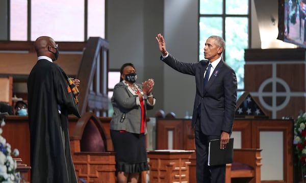 7/30/20 - Atlanta, GA -  Former President Barack Obama waves to the crowd after he delivered the eulogy.  On the sixth day of the “Celebration of Life” for Rep. John Lewis, his funeral is  held at Ebenezer Baptist Church in Atlanta, with burial to follow.   Alyssa Pointer / alyssa.pointer@ajc.com