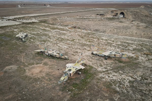 Decommissioned Syrian Air Force planes are seen at the Abu al-Duhur military airport, east of Idlib, following the takeover of the area by Syrian opposition fighters on Saturday, Dec. 7, 2024. (AP Photo/Omar Albam)