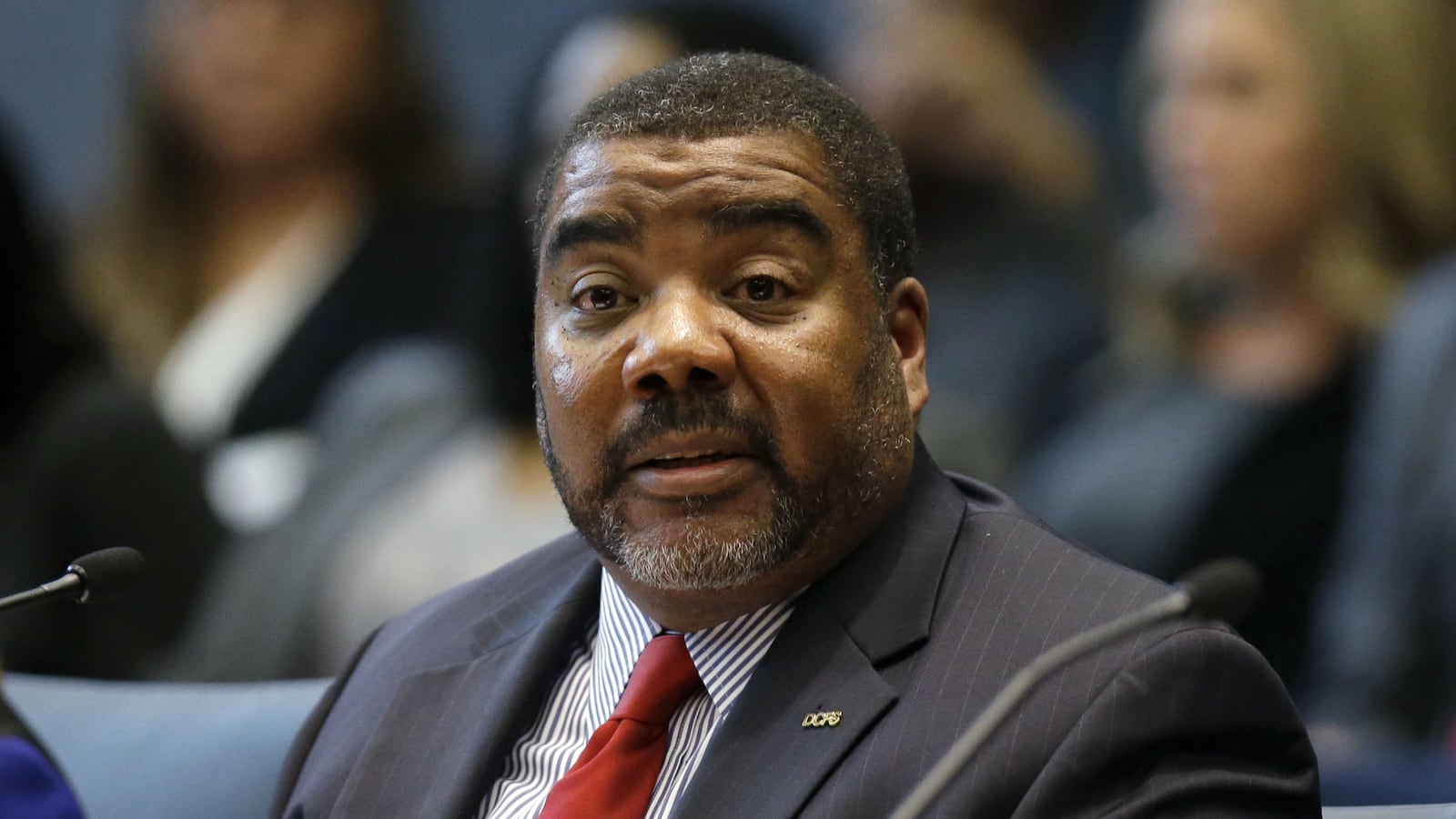 Marc D. Smith, acting director of the Illinois Department of Children and Family Services, testifies before the state House Appropriations-Human Services Committee Friday, April 26, 2019 in Chicago. The agency is under fire following the April 15 slaying of Andrew "AJ" Freund Jr. The 5-year-old, whose body was found buried in a shallow grave April 24, was allegedly beaten to death by his parents, with whom DCFS had a history of interaction dating back to the boy's birth.