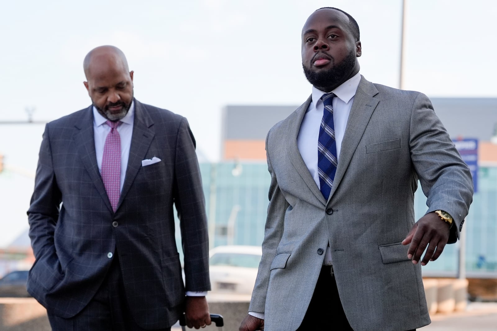 Former Memphis police officer Tadarrius Bean, right, arrives at the federal courthouse with attorney John Keith Perry, right, for the second day of jury selection for the trial in the Tyre Nichols case Tuesday, Sept. 10, 2024, in Memphis, Tenn. (AP Photo/George Walker IV)