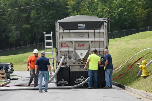 August 23, 2022 Chatsworth - Workers monitor as granular activated carbon (GAC) used to filter out PFAS and other chemicals is pumped into the bed of a truck outside the Bruce Hamler Water Treatment Facility in Rome on Tuesday, August 23, 2022. The GAC has to be periodically replaced to effectively remove contaminants from the city’s water supply. (Hyosub Shin / Hyosub.Shin@ajc.com)