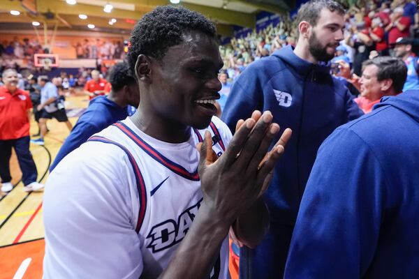 Dayton guard Enoch Cheeks celebrates after an 85-67 win against UConn in an NCAA college basketball game at the Maui Invitational Wednesday, Nov. 27, 2024, in Lahaina, Hawaii. (AP Photo/Lindsey Wasson)