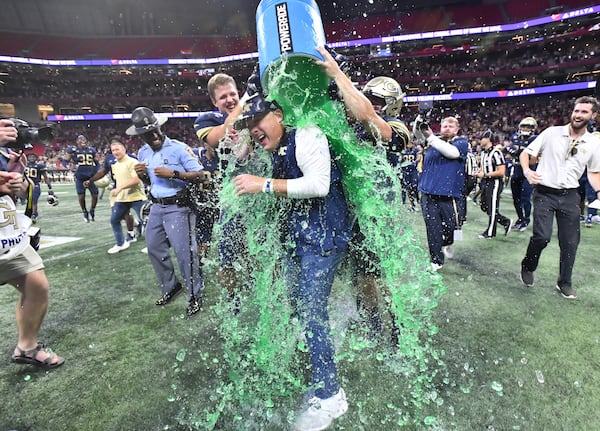 Georgia Tech head coach Geoff Collins is dunked with Gatorade by players after 45-22 win over North Carolina Saturday, Sept. 25, 2021, at Mercedes-Benz Stadium in Atlanta. (Hyosub Shin / Hyosub.Shin@ajc.com)