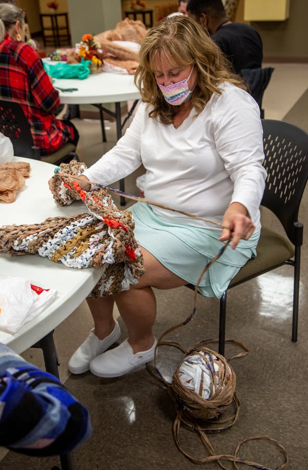 Bags2Blankets founder Janis Sims weaves a ball of plastic bags into blankets at Tucker United Methodist Church. PHIL SKINNER FOR THE ATLANTA JOURNAL-CONSTITUTION.