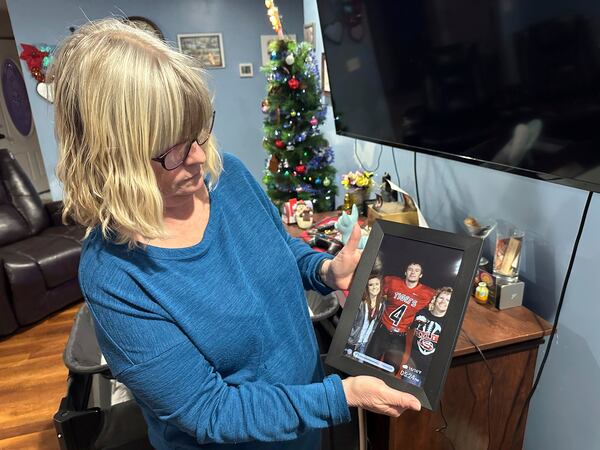 Stacey Collins Gardiner holds a picture of her son, Travis Timmerman, in her home in Urbana, Mo., Thursday, Dec. 12, 2024. Timmerman, an American citizen, was found outside Damascus, Syria, and had been imprisoned for months after crossing from Lebanon into Syria on a Christian pilgrimage. (AP Photo/Nick Ingram)