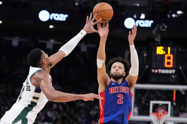 Detroit Pistons' Cade Cunningham shoots past Milwaukee Bucks' Giannis Antetokounmpo during the first half of an NBA basketball game Wednesday, Nov. 13, 2024, in Milwaukee. (AP Photo/Morry Gash)