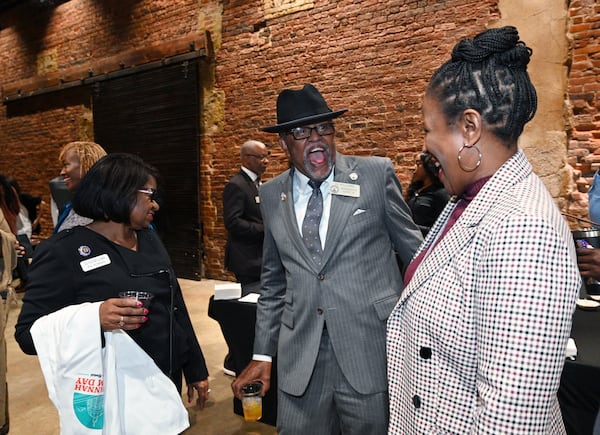 Rep. Al Williams (center), D - Midway, shares a smile with other guests during Savannah-Chatham Day Legislative Oyster Roast at Georgia Freight Depot, Wednesday, January 31, 2024, in Atlanta. (Hyosub Shin / Hyosub.Shin@ajc.com)