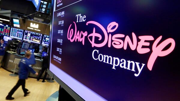 The Walt Disney Co. logo appears on a screen above the floor of the New York Stock Exchange. The Walt Disney Co. is cutting ties with Netflix and launching its own streaming service. (AP Photo/Richard Drew)