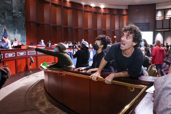 Protesters yell at council members after the vote passed 11 to 4 to approve legislation to fund the training center, on Tuesday, June 6, 2023, in Atlanta. (Jason Getz / Jason.Getz@ajc.com)