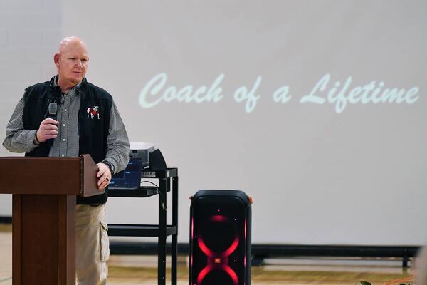 Coach Jay Wilson of Veterans Memorial Middle School in Columbus, Georgia greets guests, family and dignitaries for the dedication ceremony naming the school gymnasium’s court in his honor.  (Photo Courtesy of Darrell Roaden)