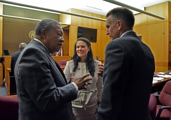 Robb Pitts (left), chairman of Fulton County Board of Commissioners, celebrates with Meria Carstarphen, superintendent of Atlanta Public Schools, and Jeff Rose (right), superintendent of Fulton County Schools after Judge Alan Harvey ruled to allow Fulton County to collect tax money for 2018. The county could be back in court to get its 2017 tax digest approved. HYOSUB SHIN / HSHIN@AJC.COM AJC FILE PHOTO