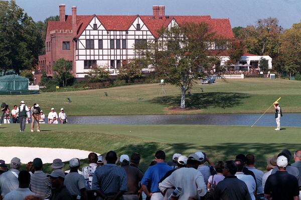 1998: The East Lake Golf Clubhouse is the backdrop as Vijay Singh putts on the 6th hole during first day of the 1998 PGA Tour Championship. 