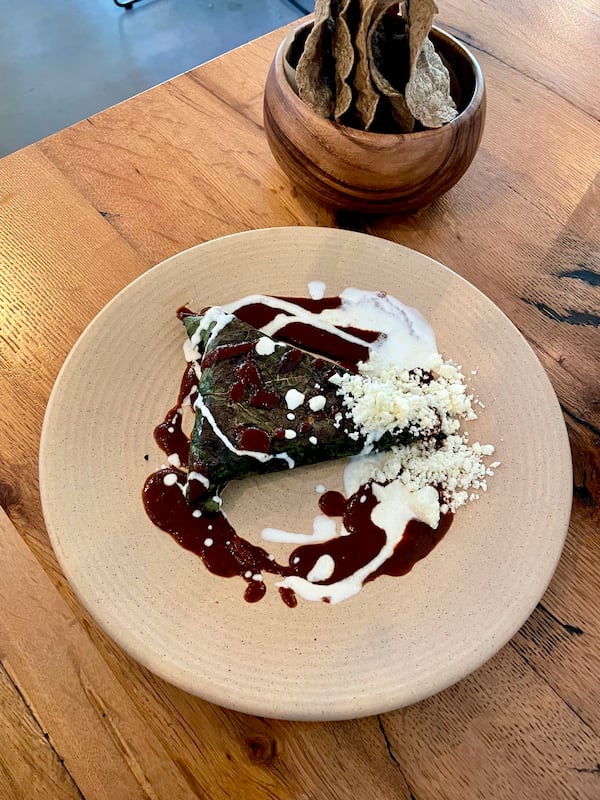 Tetela de pato with tamarind mole at Chamblee's Oaxaca. (Angela Hansberger for The Atlanta Journal-Constitution)