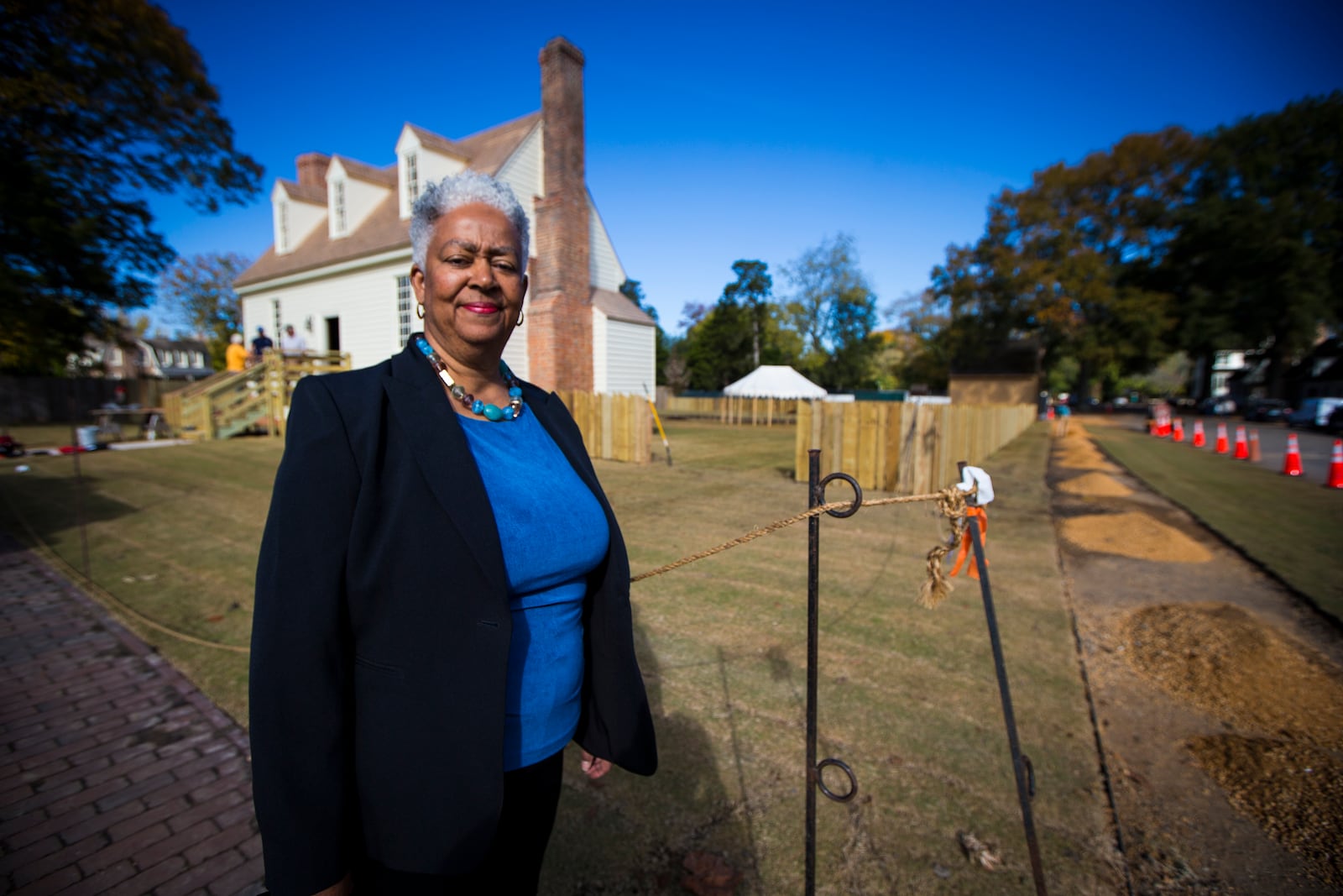 Janice Canaday, Colonial Williamsburg Foundations African American community engagement manager, stands outside near the Williamsburg Bray School on Wednesday, Oct 30, 2024 in Williamsburg, Va. (AP Photo/John C. Clark)