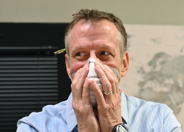 Ken Milam tweaks the fit of a new N95 mask made of a different filtration material at ThermoPore Materials Corporation, a plastics manufacturer he founded in Newnan. (Hyosub Shin / Hyosub.Shin@ajc.com)