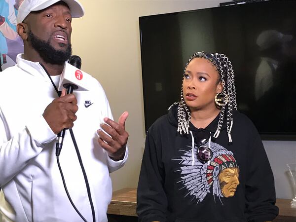 Da Brat joins Rickey Smiley briefly during a TV interview. CREDIT: Rodney Ho/rho@ajc.com