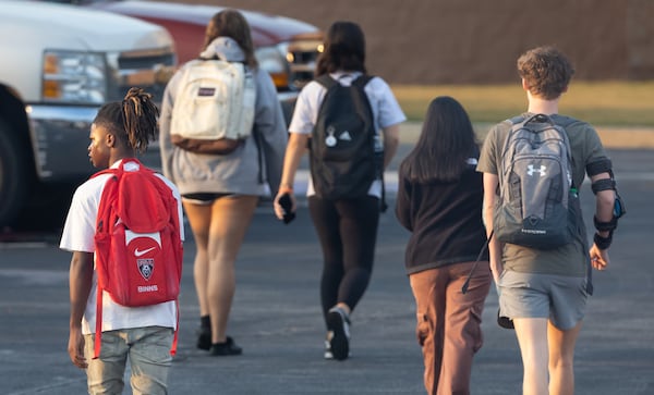 As students arrived at Apalachee High School on Tuesday morning, Sept.24, 2024 the scene looked like a typical school day. Cars and buses circled through the car pool drop-off. Students carrying backpacks made their way from the parking lot to class. Tuesday was the first day of classes at the Barrow County school since the shooting. (John Spink/AJC)