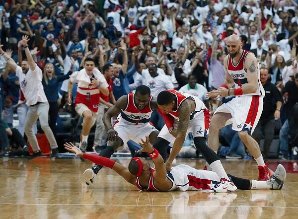 The thrill of victory. (Curtis Compton/AJC photo) Washington Wizards players mob Paul Pierce on the floor after his game winning shot as time expired after Game 3 of the second round of the NBA basketball playoffs Saturday, May 9, 2015, in Washington. The Wizards won 103-101. (Curtis Compton/Atlanta Journal-Constitution via AP) MARIETTA DAILY OUT; GWINNETT DAILY POST OUT; LOCAL TELEVISION OUT; WXIA-TV OUT; WGCL-TV OUT