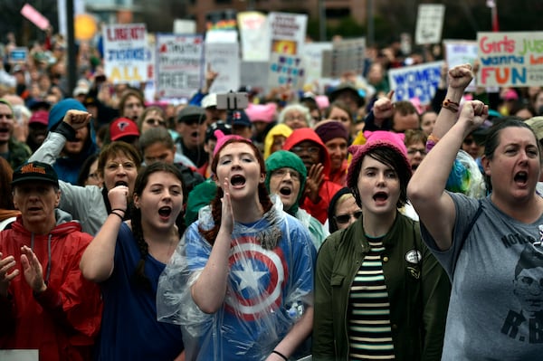 Marchers respond to speakers at the Center for Civil and Human Rights before the start of the Women’s March in Atlanta the day after the inauguration of President Donald Trump. Trump’s election has sparked a level of political activism not seen in Georgia since the early days of the conservative tea party. Opponents of the president’s policies have marched in the streets of the state’s biggest cities, channeled an avalanche of phone calls to GOP lawmakers and held a spate of town halls to try to channel that anger into activity. (DAVID BARNES / DAVID.BARNES@AJC.COM)