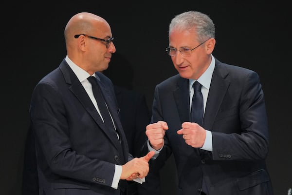 Simon Stiell, United Nations climate chief, left, and Mukhtar Babayev, COP29 President, speak at an opening plenary session during the COP29 U.N. Climate Summit, Monday, Nov. 11, 2024, in Baku, Azerbaijan. (AP Photo/Peter Dejong)