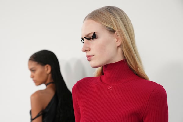 A model wears backstage a creation as part of Courreges Fall/Winter 2025-2026 Womenswear collection presented Wednesday, March 5, 2025. in Paris. (Photo by Scott A Garfitt/Invision/AP)