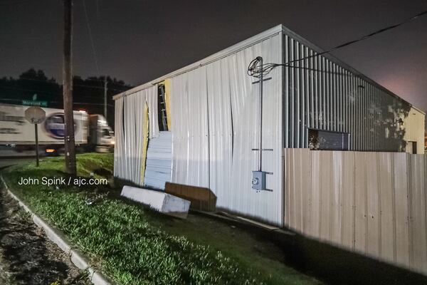 Georgia Imports on the corner of Moreland Avenue and Key Road is boarded up after a car ran off the road and slammed into the business late Sunday night. JOHN SPINK / JSPINK@AJC.COM